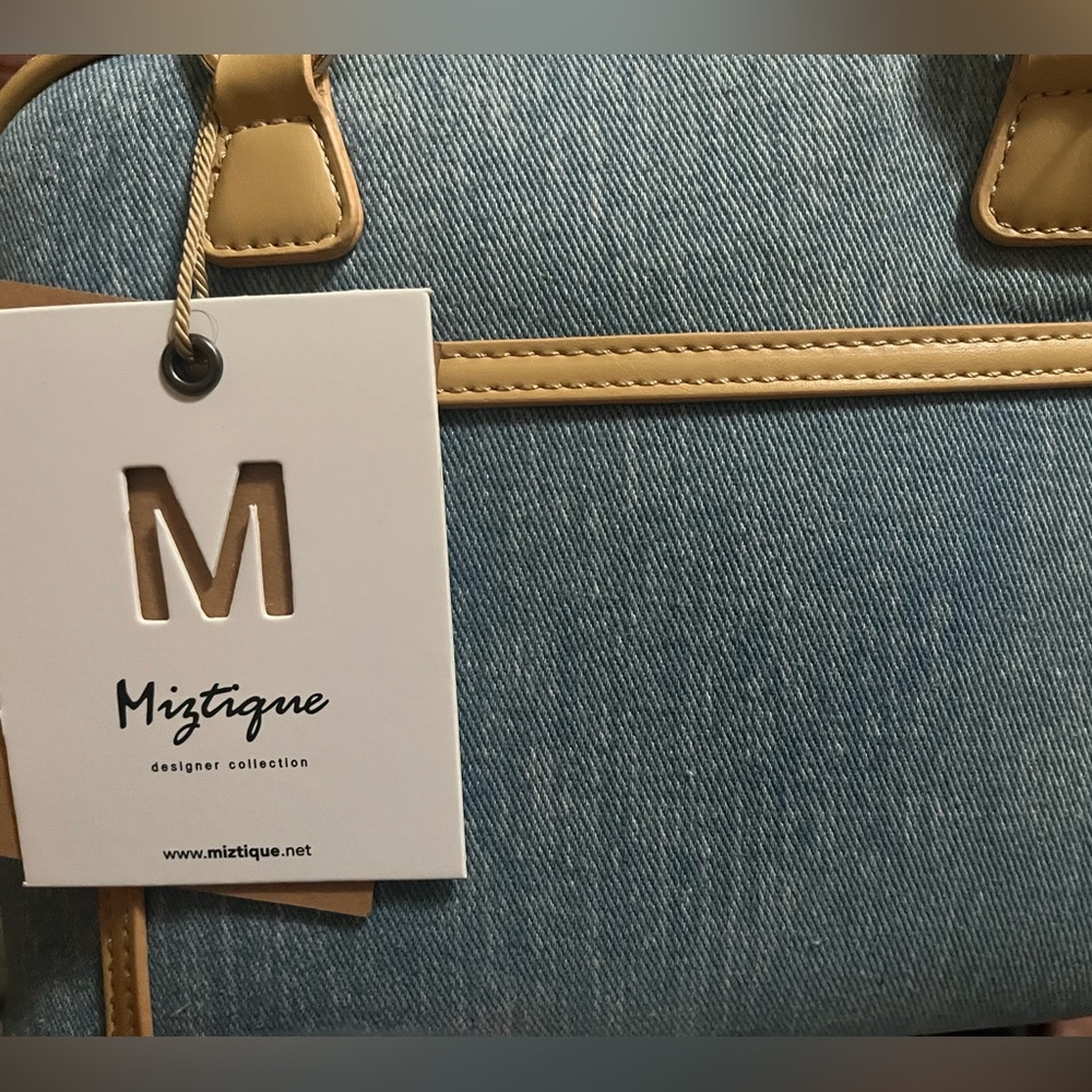 Denim handbag with tan outline. New by Miztique designer collection. Negotiable